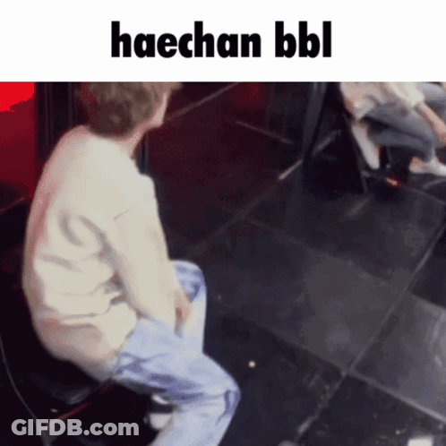 A Man Is Sitting On A Chair With The Words Haechan Bbl Written Above Him GIF