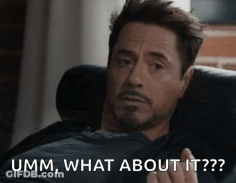 A Man Is Sitting On A Couch And Making A Funny Face While Talking About Something . GIF