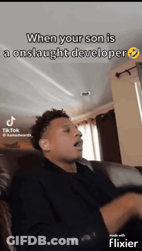A Man Is Sitting On A Couch And Making A Funny Face With The Caption When Your Son Is An Onslaught Developer GIF