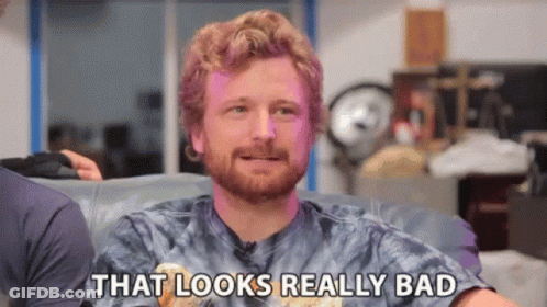 A Man Is Sitting On A Couch And Saying That Looks Really Bad GIF