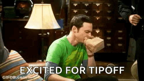 A Man Is Sitting On A Couch Eating A Bag Of Food With The Words Excited For Tipoff Written Above Him . GIF