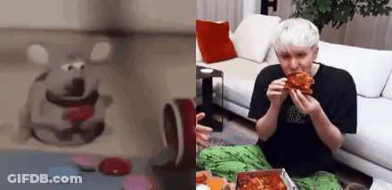 A Man Is Sitting On A Couch Eating A Pizza . GIF