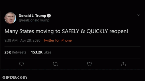 A Man Is Sitting On A Couch In A Living Room With A Lamp In The Background . GIF