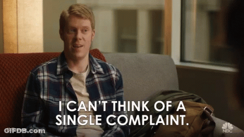 A Man Is Sitting On A Couch Saying I Can 'T Think Of A Single Complaint GIF