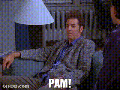 A Man Is Sitting On A Couch Talking To Another Man And Says Pam . GIF