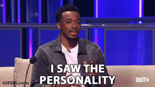 A Man Is Sitting On A Couch With A Microphone And Says " I Saw The Personality " GIF
