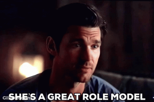 A Man Is Sitting On A Couch With His Eyes Closed And Says She 'S A Great Role Model GIF