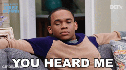 A Man Is Sitting On A Couch With His Eyes Closed And The Words You Heard Me Behind Him GIF