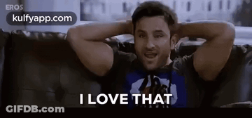 A Man Is Sitting On A Couch With His Hands Behind His Head And Says I Love That . GIF