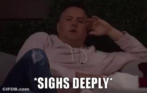 A Man Is Sitting On A Couch With His Hands On His Head And The Words `` Sighs Deeply '' Written Next To Him . GIF