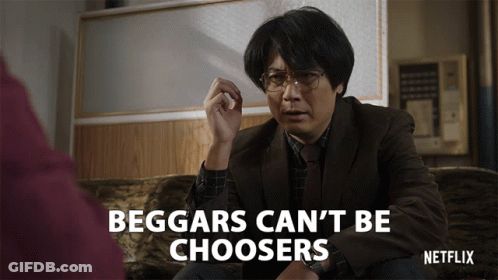 A Man Is Sitting On A Couch With The Words Beggars Can 'T Be Choosers On The Bottom GIF