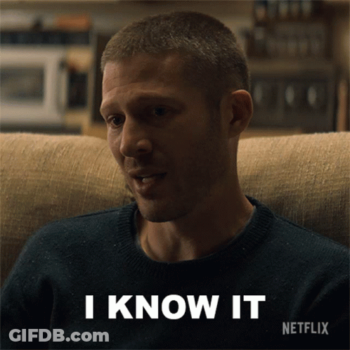A Man Is Sitting On A Couch With The Words I Know It Written Below Him GIF
