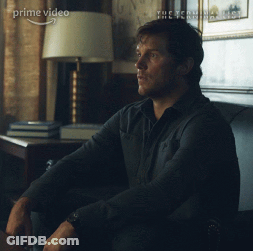 A Man Is Sitting On A Couch With The Words Yes Sir Written On His Face GIF
