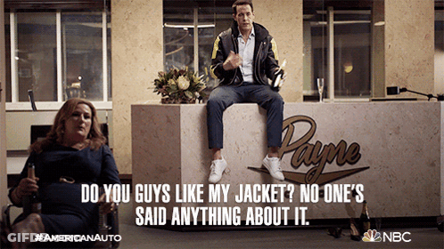Man Sitting On Counter In Front Of Payne Logo GIF