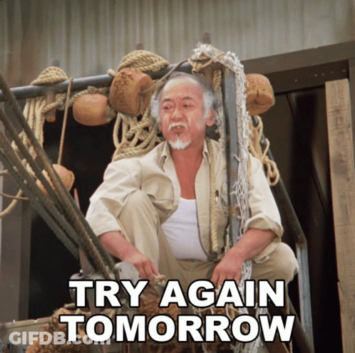 A Man Is Sitting On A Ladder With The Words Try Again Tomorrow Written Below Him GIF