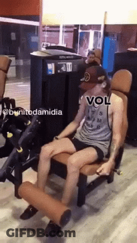A Man Is Sitting On A Machine In A Gym With A Caption That Says Vol GIF