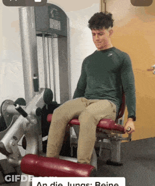 A Man Is Sitting On A Machine That Says An Die Lungs GIF