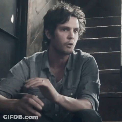 A Man Is Sitting On A Set Of Stairs With The Word Wussy Written On The Bottom GIF
