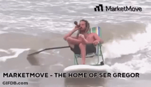 A Man Is Sitting On A Surfboard In The Ocean While Drinking From A Bottle . GIF