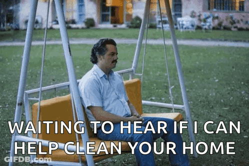 A Man Is Sitting On A Swing With The Words Waiting To Hear If I Can Help Clean Your Home GIF