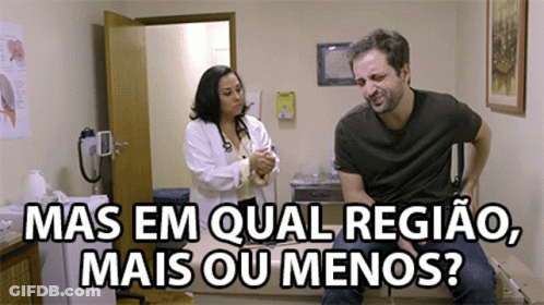 A Man Is Sitting On A Table With A Doctor And The Words Mas Em Qual Regiao Mais Ou Menos Below Him GIF