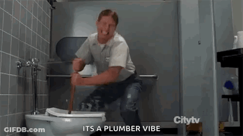 A Man Is Sitting On A Toilet With A Plunger In His Hand In A Bathroom . GIF