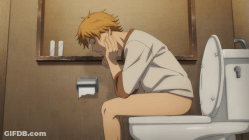 A Man Is Sitting On A Toilet With His Head On His Hand GIF