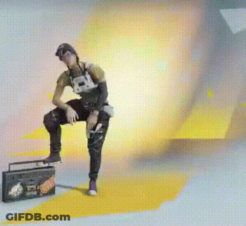 A Man Is Sitting On The Floor Next To A Boombox With A Sticker On It That Says ' I Love You ' GIF