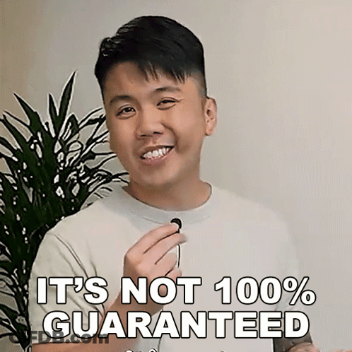 A Man Is Smiling And Holding A Microphone With The Words " It 'S Not 100 % Guaranteed " Next To Him GIF