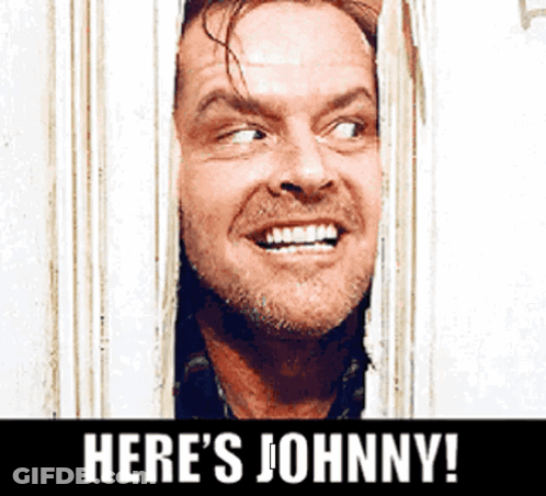 A Man Is Smiling And Looking Through A Window With The Words Here 'S Johnny Below Him GIF