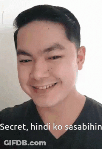 A Man Is Smiling And Making A Funny Face With The Words Secret , Hindi Ko Sasabihin . GIF