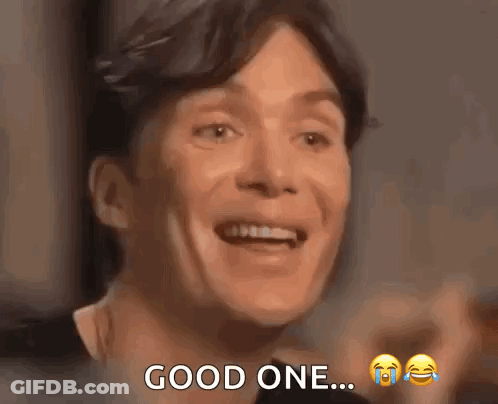 A Man Is Smiling And Saying `` Good One '' While Crying . GIF