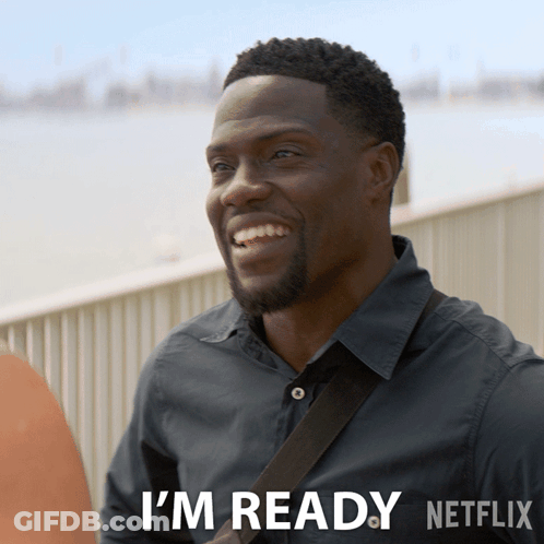 A Man Is Smiling And Says I 'M Ready Netflix On The Bottom GIF
