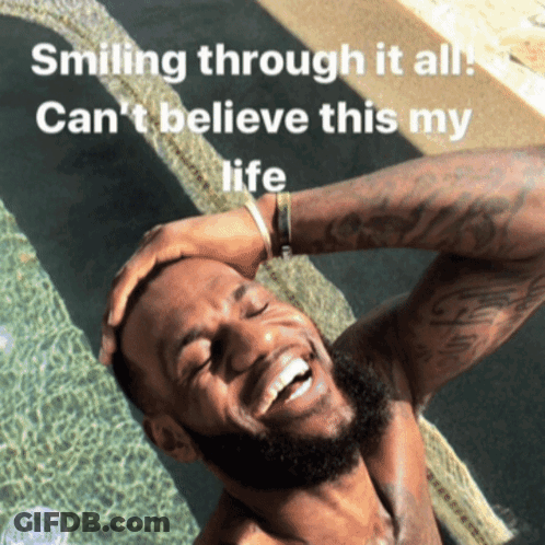 A Man Is Smiling In A Pool With The Words Smiling Through It All Can 'T Believe This My Life GIF
