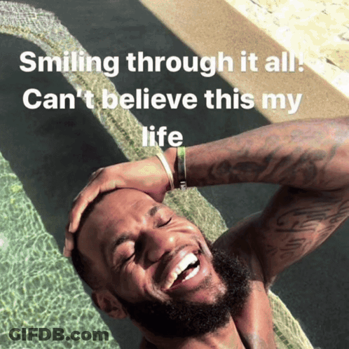 A Man Is Smiling In A Pool With The Words Smiling Through It All Can 'T Believe This My Life Below Him GIF