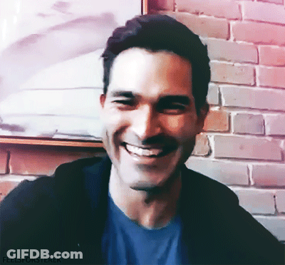 A Man Is Smiling In Front Of A Brick Wall With The Words Feelsforsterek Written Below Him GIF