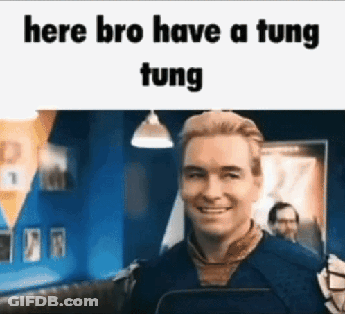 A Man Is Smiling In Front Of A Sign That Says Here Bro Have A Tung Tung . GIF