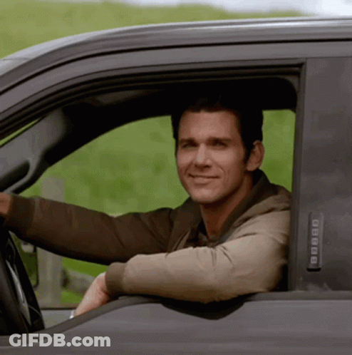 A Man Is Smiling While Driving A Truck With A Keypad That Says 8888 GIF