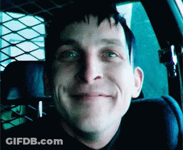 A Man Is Smiling While Sitting In A Car GIF