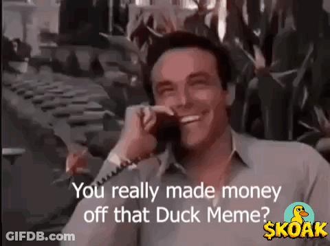 A Man Is Smiling While Talking On A Cell Phone And Says `` You Really Made Money Off That Duck Meme ? '' GIF