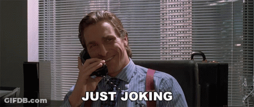 A Man Is Smiling While Talking On A Phone And The Words Just Joking Are Above Him GIF