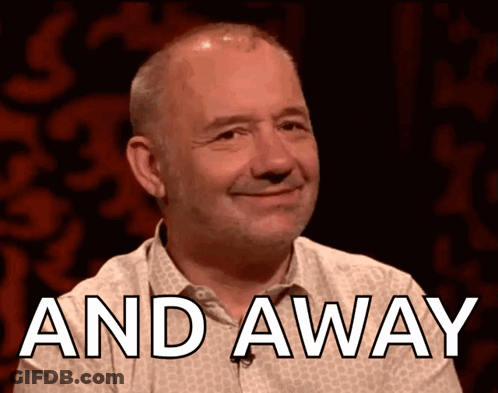 A Man Is Smiling With The Words " And Away " Above Him GIF