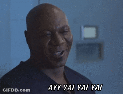 A Man Is Smiling With The Words Ayy Yai Yai Yai Behind Him GIF
