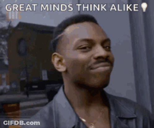 A Man Is Smiling With The Words Great Minds Think Alike GIF