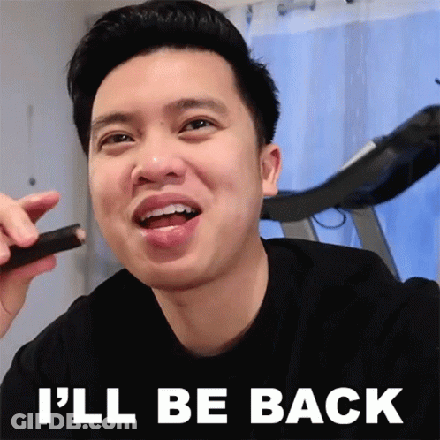 A Man Is Smiling With The Words " I 'Ll Be Back " Above Him GIF