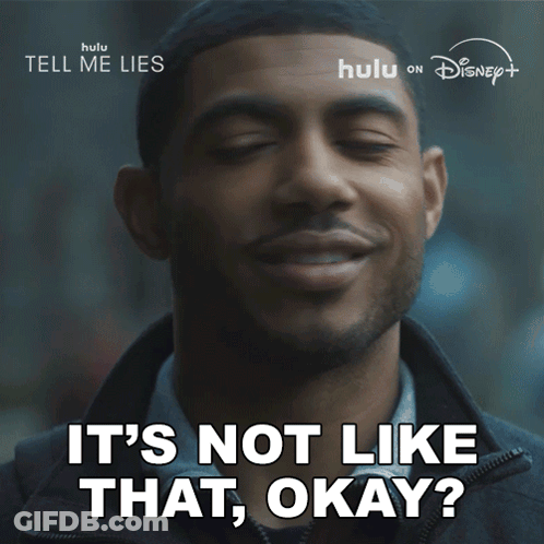 A Man Is Smiling With The Words " It 'S Not Like That Okay " Below Him GIF