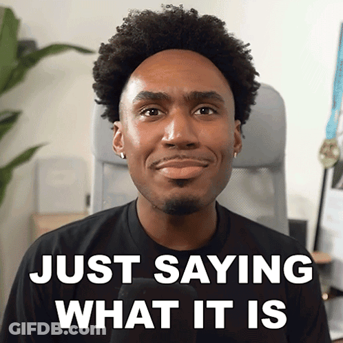A Man Is Smiling With The Words Just Saying What It Is Behind Him GIF