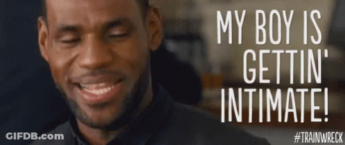 A Man Is Smiling With The Words " My Boy Is Gettin ' Intimate " On The Bottom GIF