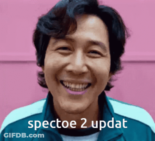A Man Is Smiling With The Words " Spectoe 2 Updat " Written Below Him GIF