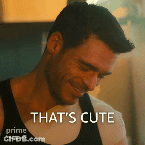 A Man Is Smiling With The Words That 'S Cute Behind Him GIF